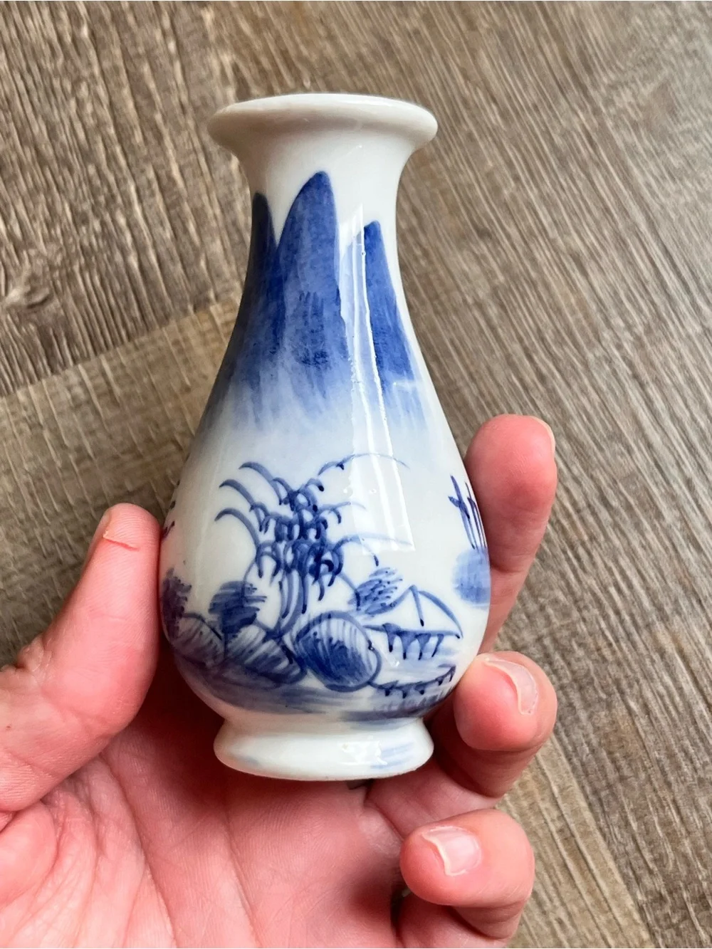 Chinese style porcelain bud vase with a flared rim and hand-painted landscape
